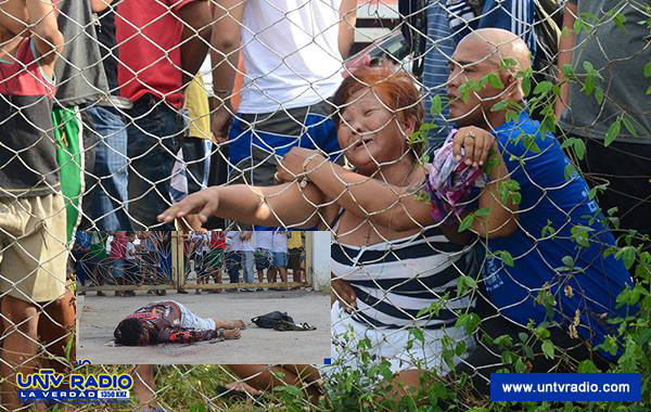 A loved one of a slain suspected member of the Pampanga-based Jimboy Santos crime group cries helplessly as she watches her loved one’s lifeless body (inset) on a shootout, June 20./UNTV Radio photo